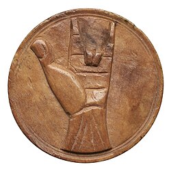 Round tessera showing left hand with middle two fingers folded towards palm