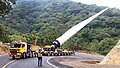 Mercedes-Benz SK Ballast Tractor pulling Goldhofer hydraulic modular trailer with FTV 300 blade lifter carrying a Wind turbine blade.