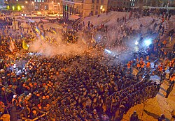 Protesters clashing with riot police on 11 December 2013