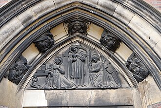 Tympanum reliefs over entrance to St Agatha, Sparkbrook