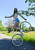 Viola Brand performing a bicycle stunt