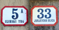 Historic Kaptol house number plate in Onyx typeface (left, repainted) and a modern one in Ilica (right)