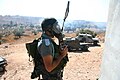 A border police officer with a tear gas mask.
