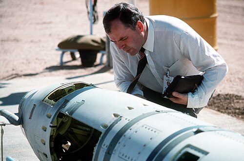 A Soviet inspector examines a BGM-109G ground-launched cruise missile in 1988 prior to its destruction.