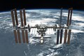 Image 6The International Space Station (ISS) as seen from the Space Shuttle Endeavour. Zarya, the first module of the ISS launched in 1998, is seen in the foreground. Since then, twenty-six Space Shuttle flights have docked with the ISS to assemble various other modules and components, which include four pairs of solar arrays seen on each side.