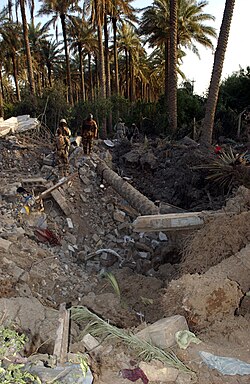 U.S. Army 3rd Heavy Brigade Combat Team, 4th Infantry Division Public Affairs Office at the site of Abu Musab al-Zarqawi's bombed out safe house on June 8, 2006