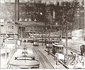 Roller coasters of Palisades Amusement Park are visible above the trolley terminal in Edgewater, New Jersey in the early 20th century