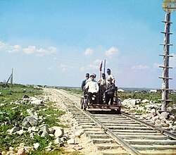 Handcar riding along the Murmansk railroad, on the shore of Lake Onega. (circa 1916)