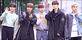 NU'EST in May 2019From left to right: Ren, JR, Aron, Minhyun, and Baekho