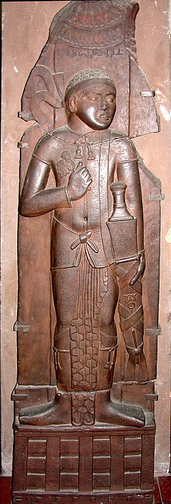 Indian relief of possible Indo-Greek king, with Buddhist triratana symbol on his sword