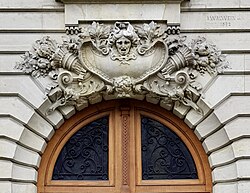 Two Beaux-Arts mascarons of Avenue Henri-Martin no. 87, Paris, designed by Albert Walwein, 1892