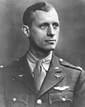 Man with army uniform looking off to the side.