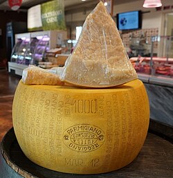 A wheel and three slices of Parmesan