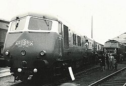 A black and white photo of a Pullman locomotive, which are distinctive due to the shape of the front, which although it is streamlined is made up of quite flat plates