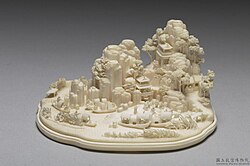 Miniature landscape with figures, Qing dynasty, 18th–19th century. Carved from a single piece of ivory depicting mountains, pavilions, bridges, streams, nine boats, and thirty-four figures. National Palace Museum.