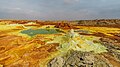 Image 3DallolPhotograph credit: Alexander SavinDallol is a cinder-cone volcano in the Danakil Depression, northeast of the Erta Ale Range in Ethiopia. The area lies up to 120 m (390 ft) below sea level, and has been repeatedly flooded in the past when waters from the Red Sea have inundated it. The Danakil Depression is one of the hottest places on Earth, and the evaporation of seawater after these flooding episodes produced thick deposits of salt, as seen in this landscape. The deposits at Dallol include significant quantities of the carbonate, sulfate and chloride salts of sodium, potassium, calcium and magnesium. Hot springs discharge brine to form the blueish ponds, and small, temporary geysers produce cones of salt.More selected pictures