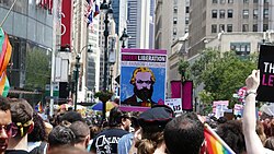 A Marxist sign reading "Queer Liberation, Not Rainbow Capitalism" in 2019