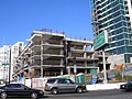 Work on the townhouses as traffic destined for the Bay Bridge passes by.