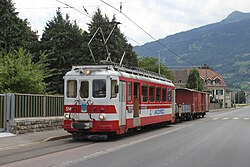AOMC BDeh 4/4 514 pulls a mixed train at Collombey-Muraz in 2011