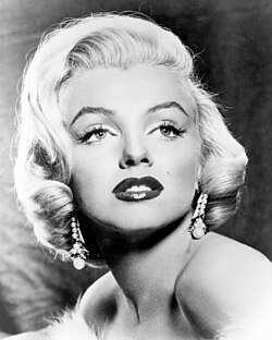 Black-and-white photo of a woman with short, blonde hair