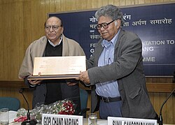 Man receiving award in a classroom