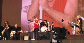 Bon Jovi performing in Hyde Park, London in 2013. From left to right: Phil X, Hugh McDonald, Jon Bon Jovi, Tico Torres, and David Bryan.