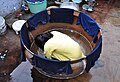 A traditional brass container used to dye cloth in quantity