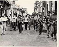 Combatientes entrando en León