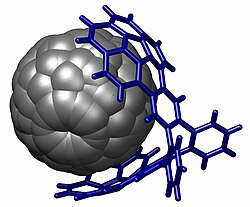A fullerene bound in a buckycatcher through aromatic stacking interactions.