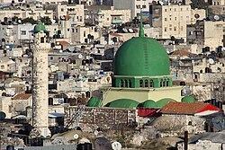 a mosque with green dome an 1 minaret
