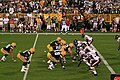 The Bears defense take on Packers quarterback Brett Favre