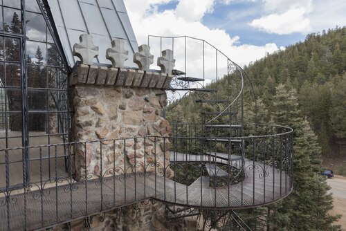 A rocky twist and turn along a soaring tower of Bishop Castle.