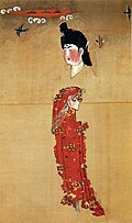 Unearthed at the Astana Graves in 1972 from the tomb number 187. The background contains a bamboo plant. The image was to the right side of an image of a woman playing go. The tomb also contained a copy of the book "Tian Bao San Zai" dated to the year 744.