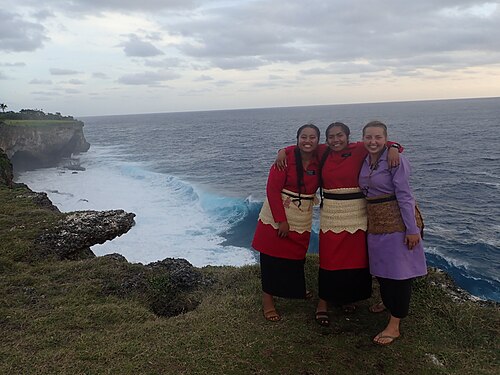 Missionaries wearing traditional woven mats - called ta'ovala.