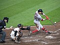 Image 25Boston Red Sox player Mookie Betts hits a pitch by swinging his bat. (from Baseball)