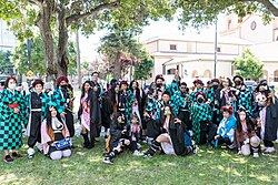 Popular Japanese media franchises such as Demon Slayer: Kimetsu no Yaiba, Chainsaw Man, Jujutsu Kaisen, Oshi no Ko, Frieren, Attack on Titan, Spy × Family, Dr. Stone, One Piece, Umamusume, Blue Lock, and Mashle reaching large international audiences and fans used for crossover works during the Reiwa era.