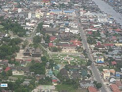 An aerial view of Pangkalan Bun, looking towards the south with the Arut River in the top right-hand corner of the view