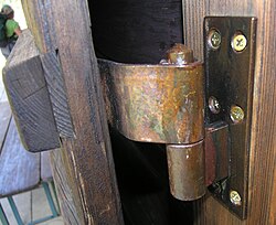 A barrel hinge made of bronze strap