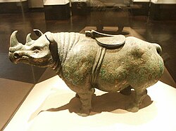 A Chinese Western Han dynasty (202 BCE – 9 CE) bronze rhinoceros with gold and silver inlay