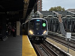 An R211 car arriving at the station in October 2025.