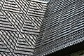 This highly decorative roof has a "closed valley": the valley where the two roofs meet is completely shingled and has metal flashing below the wood to prevent leaks. St. Olaf's Church in Tyrvää, Sastamala, Finland.