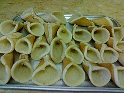 Folded qatayef, not yet stuffed or fried.