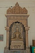 Lord Adinath, Chandella period, shrine 6 (Note Navagraha, Sarvanha and Chakreshwari in the platform.)