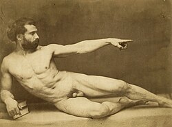 Black and white photograph of a nude figure in academic pose