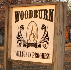 Sign in the public square of Woodburn, Illinois.