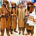 A group of Baloch men wearing traditional Baloch male dress