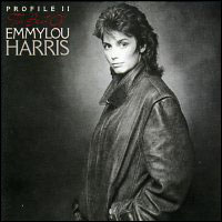 half-length brown and black duotone photo of Emmylou Harris with a shag haircut looking towards camera and wearing a leather jacket