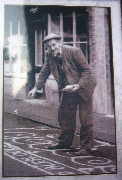 File:Man Sanding the street in Knutsfrod for May Day 1920.jpg