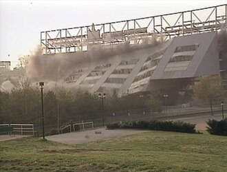 Building being demolished from explosives.