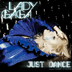 Lady Gaga lying down wearing a dark blue dress with a big, layered collar. Her right hand touches her forehead. Beneath her left eye is a blue-colored lightning-shaped sticker.